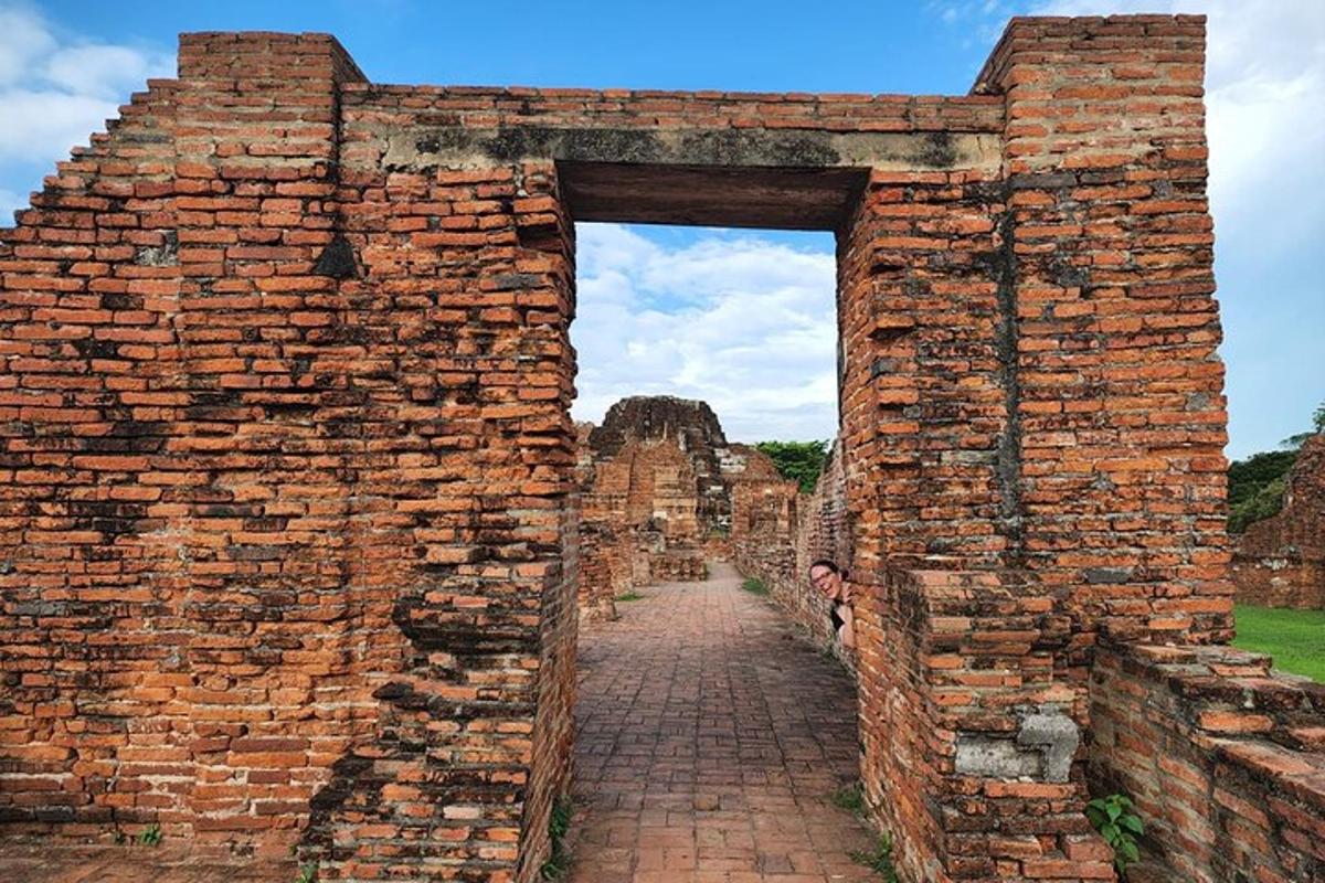 an archway in an old brick wall