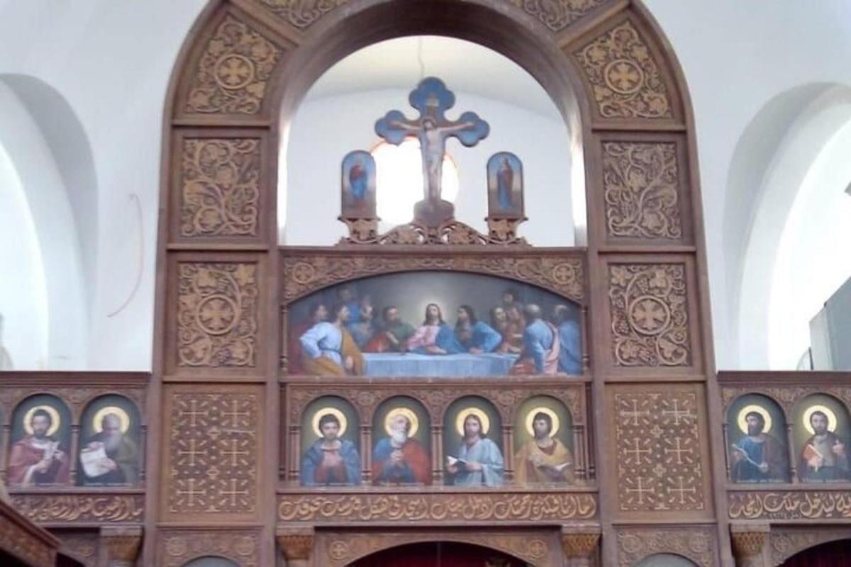 a church with a cross and a bunch of icons