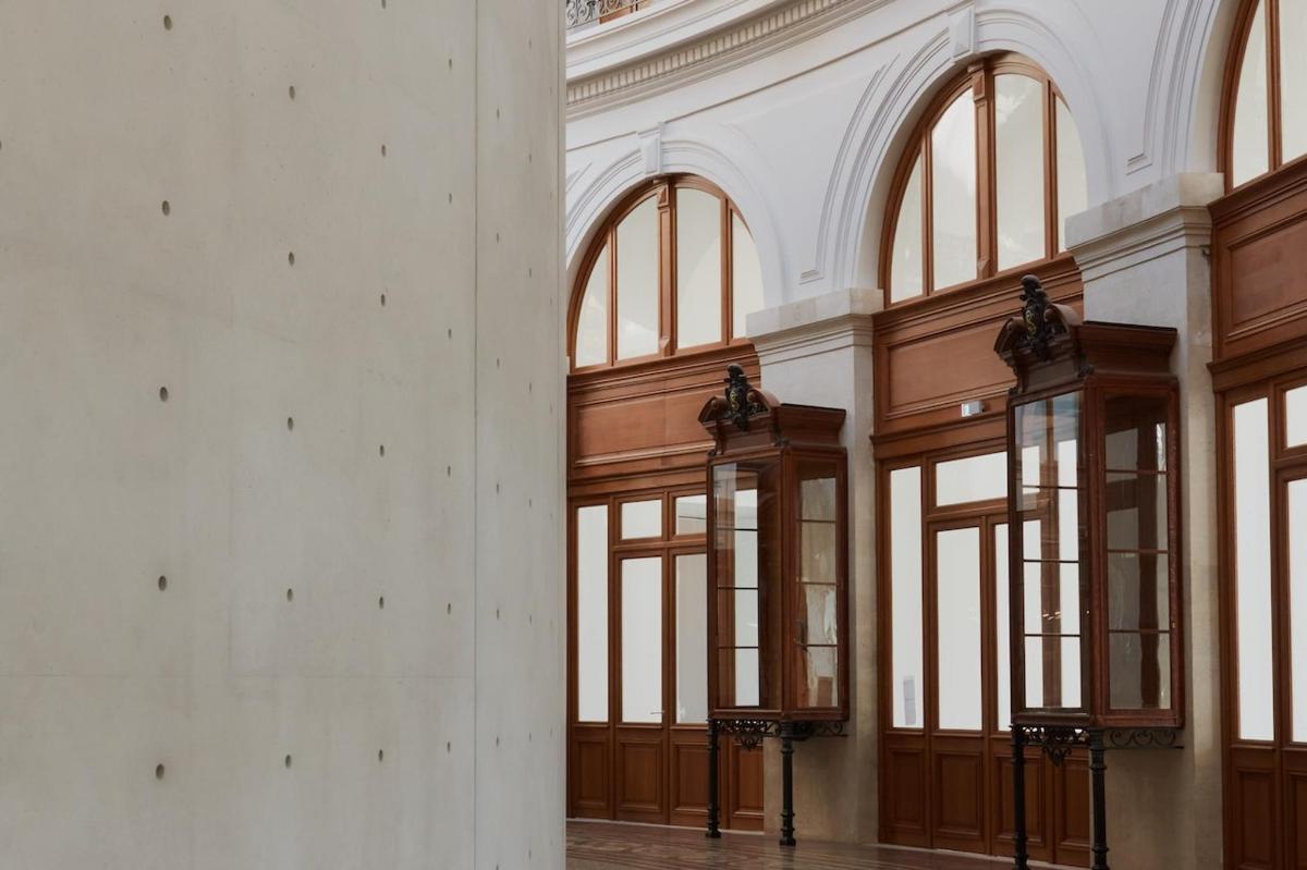 a large room with large windows in a building
