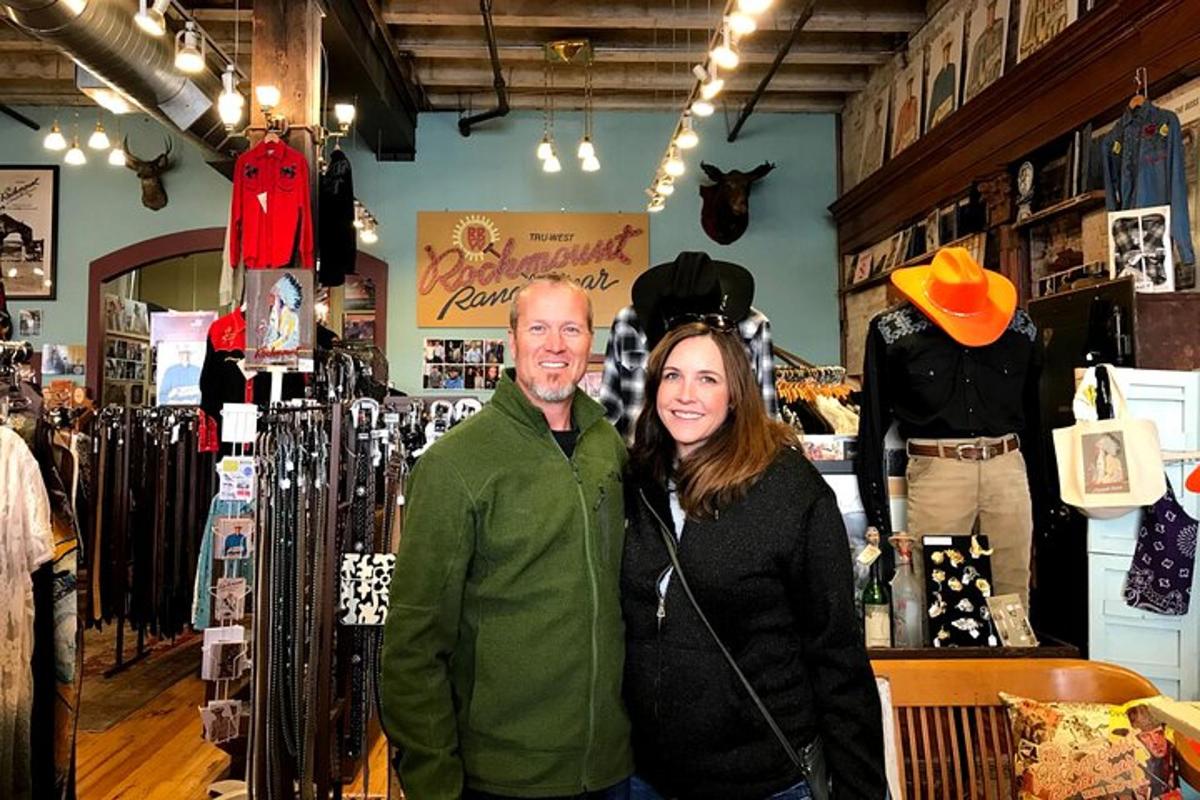 a man and woman posing for a picture in a store