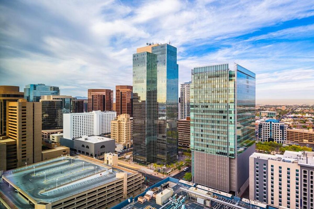an aerial view of a city with tall buildings