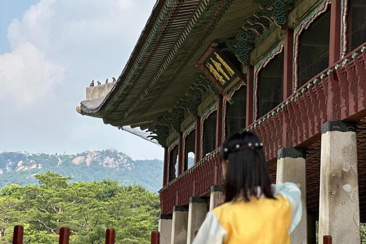 a woman looking out of a building at a castle