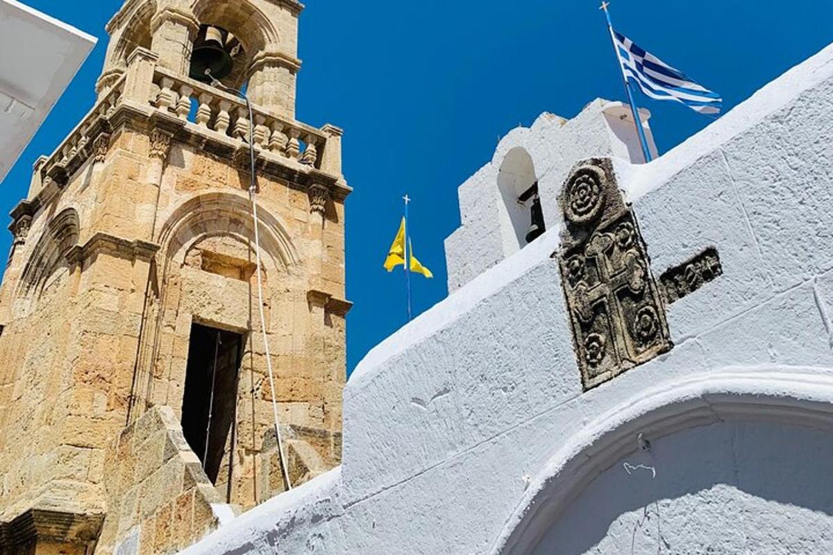 a building with a clock tower and a flag