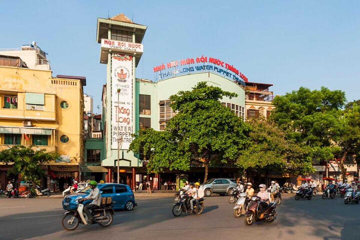 a group of people riding motorcycles down a city street