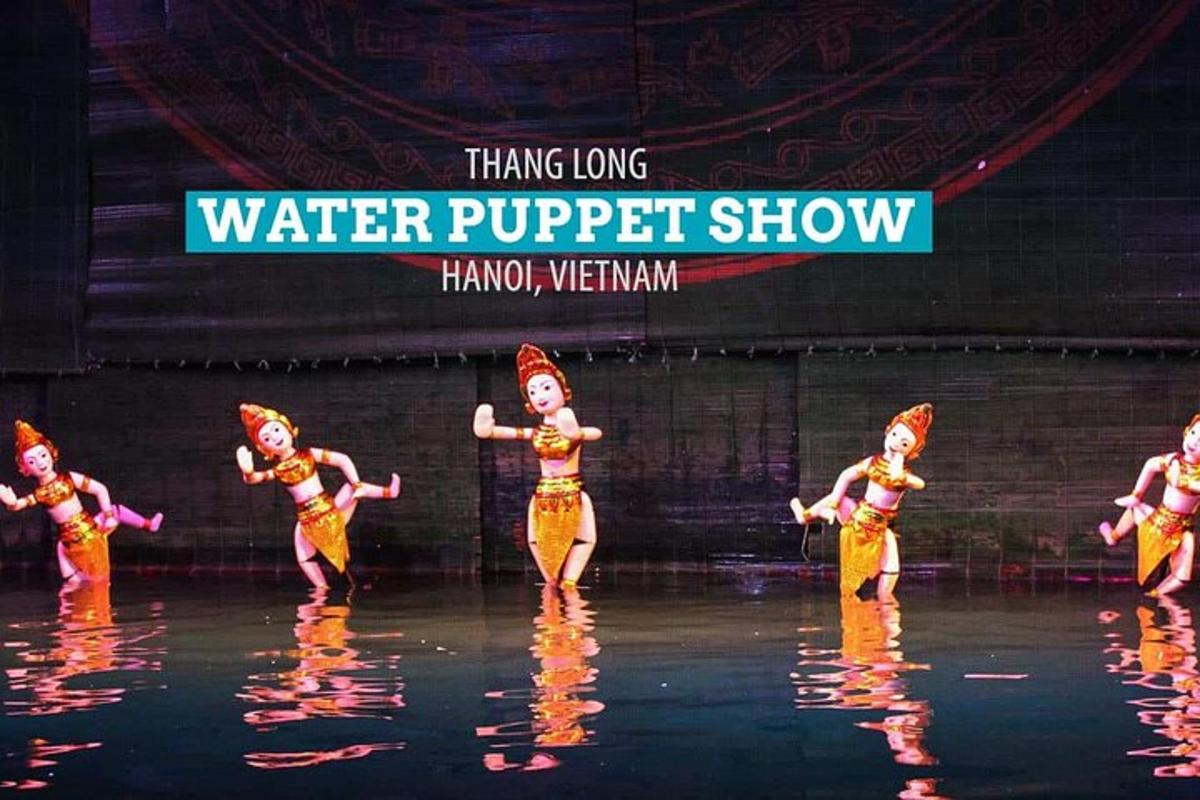 a group of women performing a water puppet show