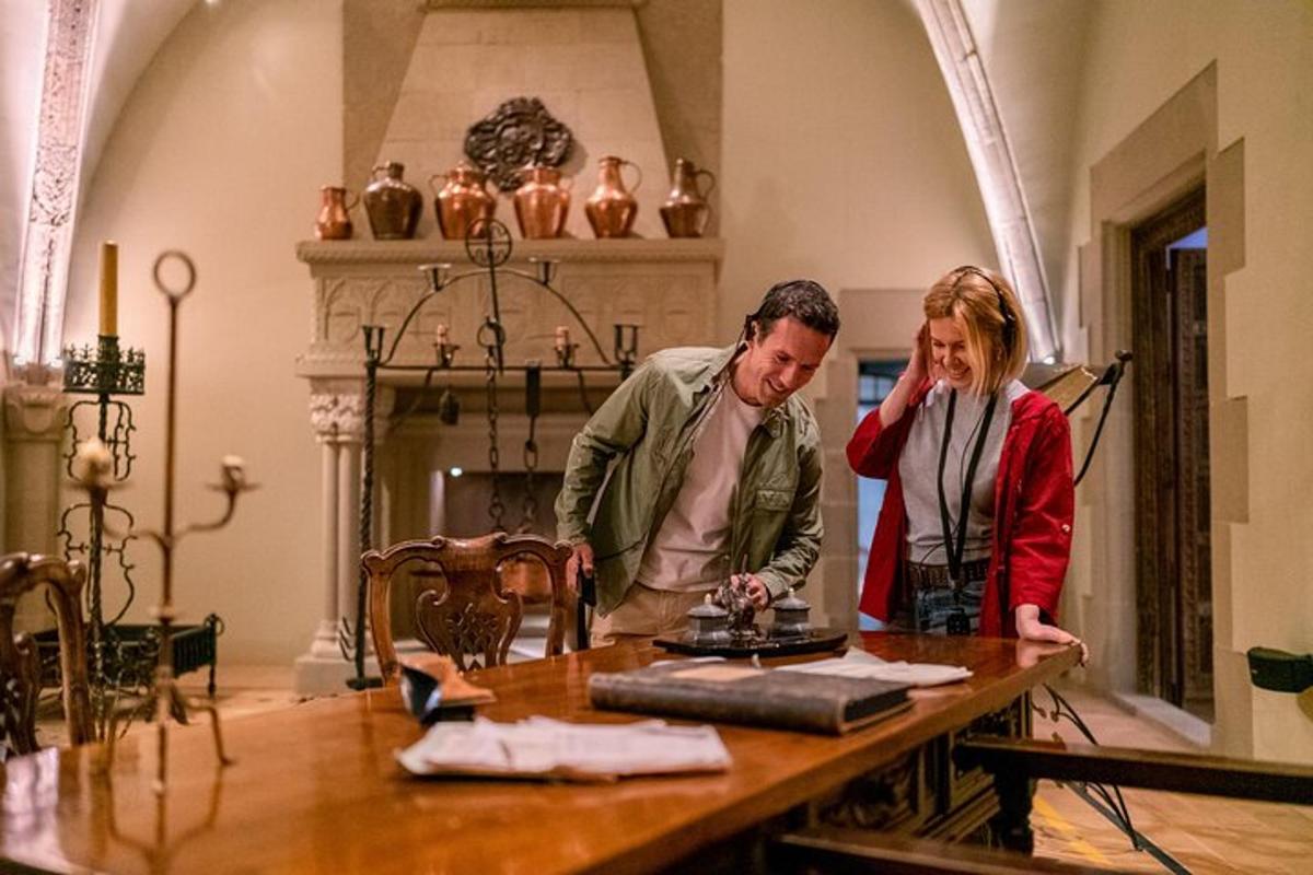 a man and a woman standing at a table