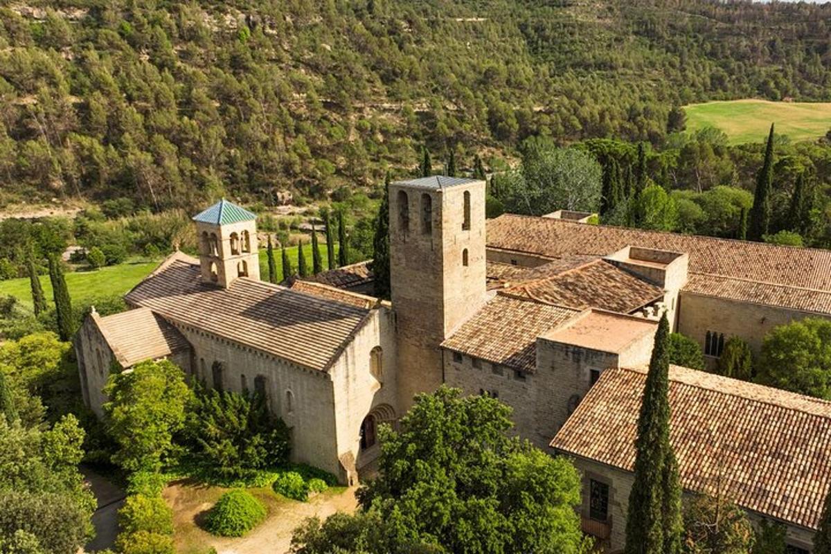 an aerial view of a large building with trees