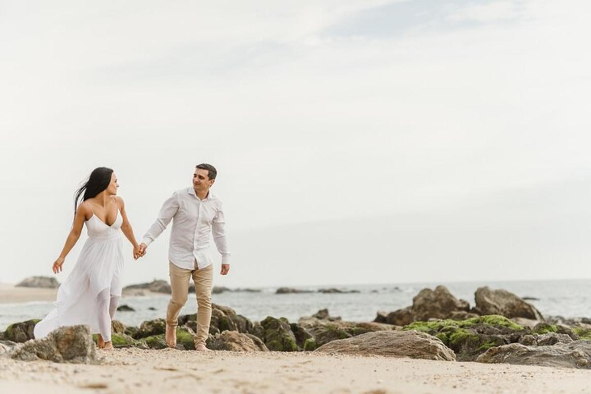a bride and groom walking on the beach