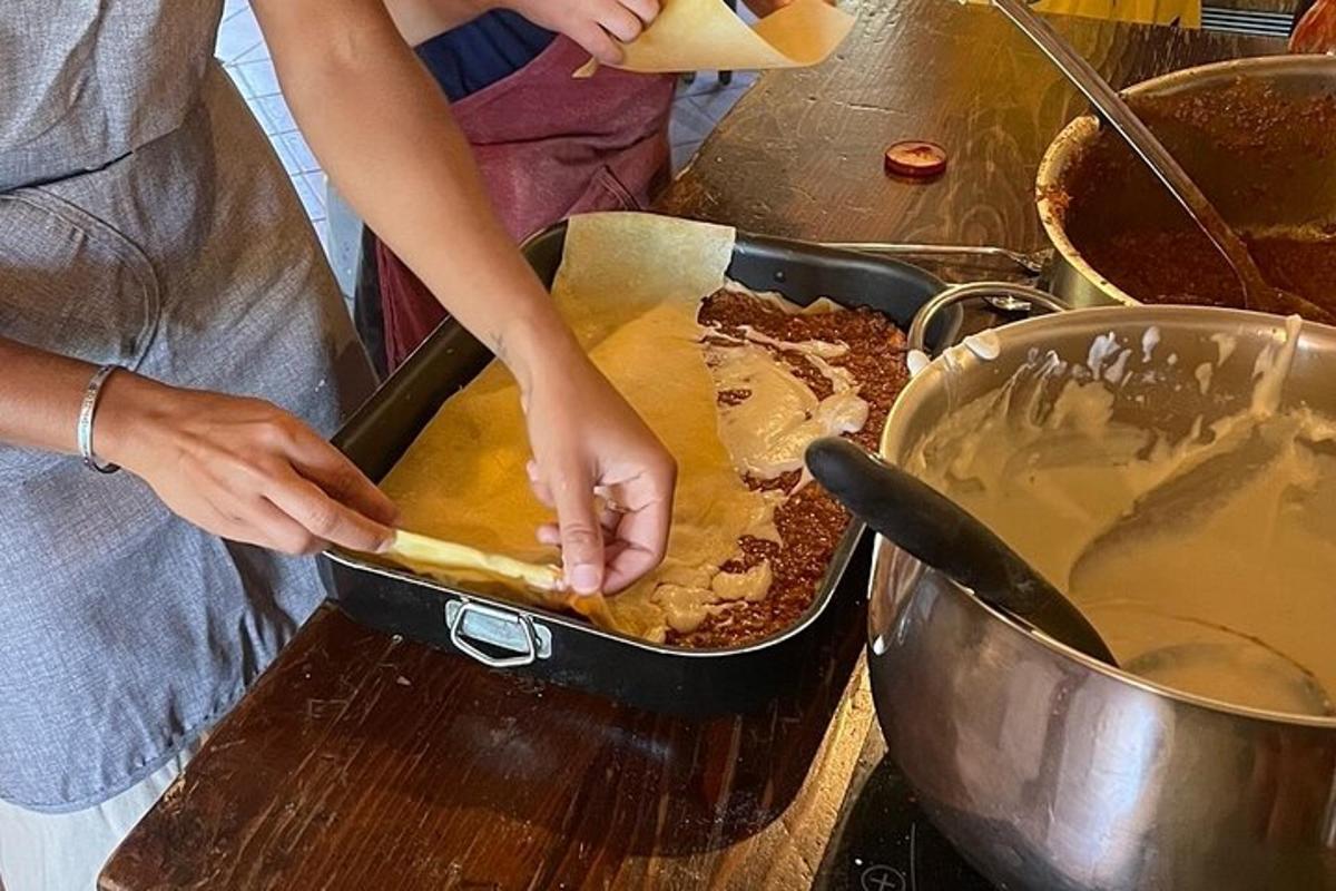 a person preparing food in a pan on a table