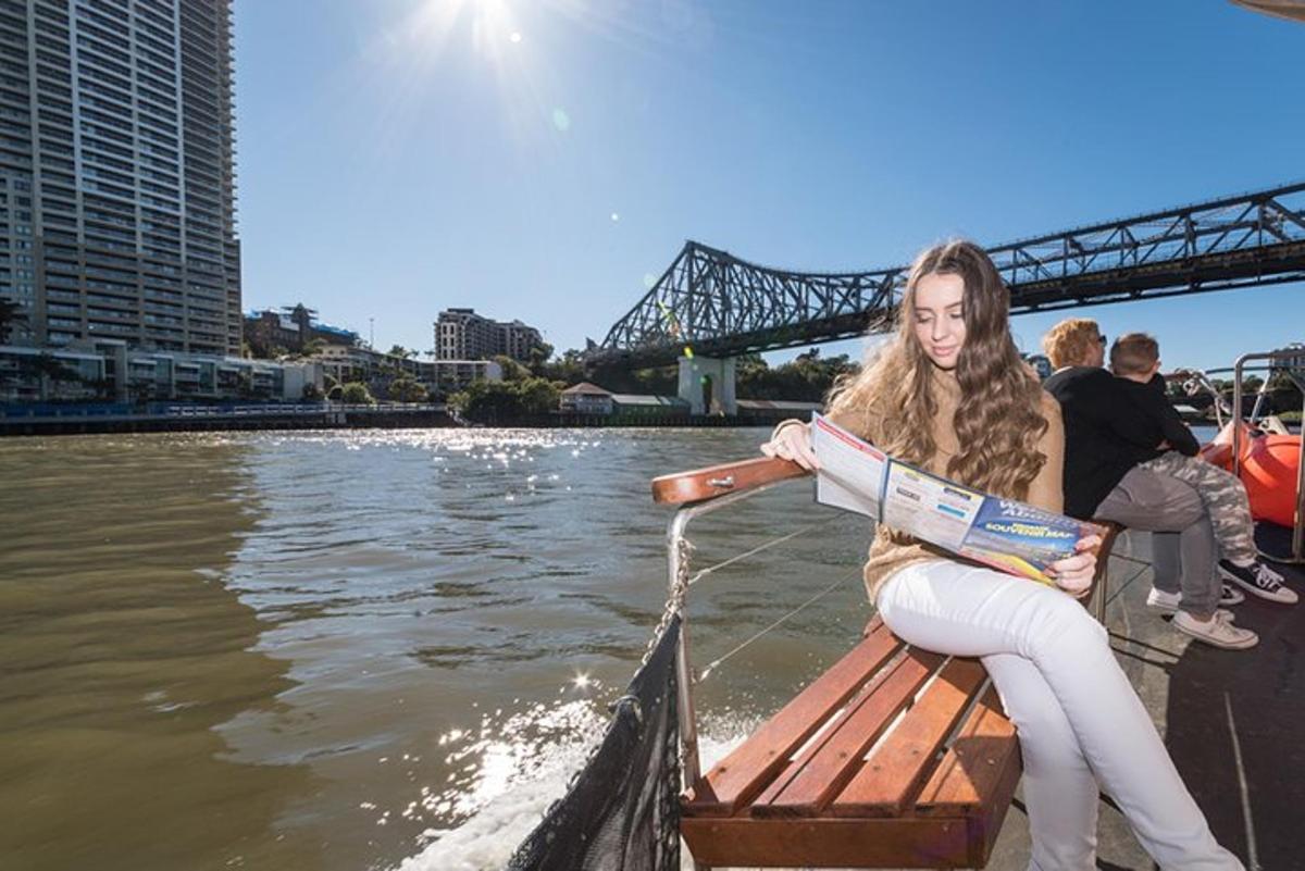 a woman sitting on a boat in the water