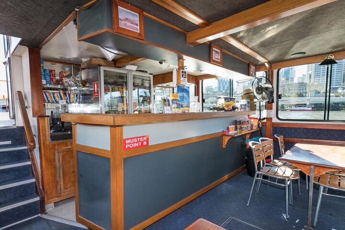 a bar in a restaurant with a table and chairs