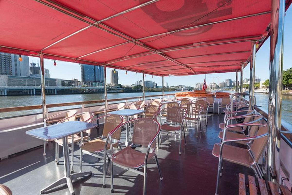 a group of tables and chairs on a boat