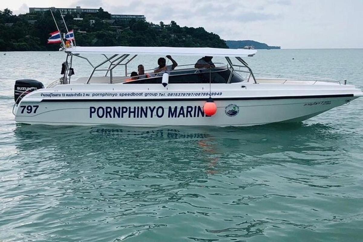 a group of people on a boat in the water