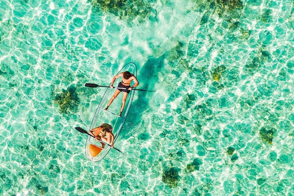 two people on a surfboard in the water