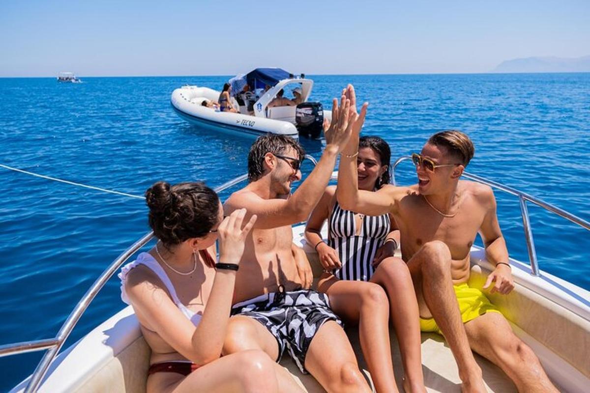 a group of people sitting on a boat in the water