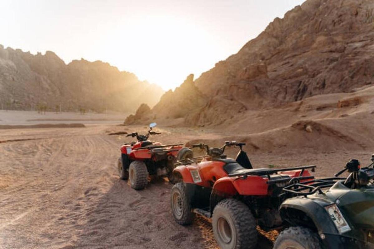 a group of atvs and atvs on a dirt road