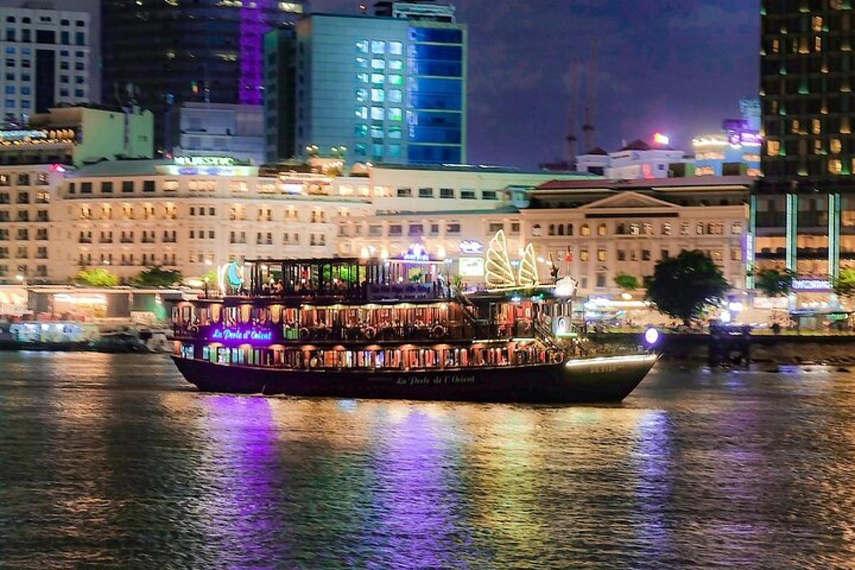 a boat filled with people on the water at night