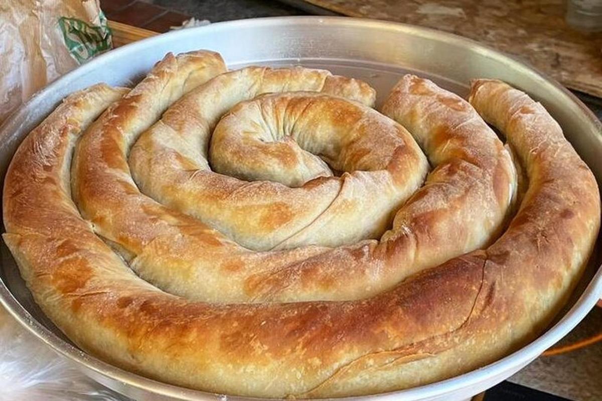 a metal bowl with two rings of bread in it