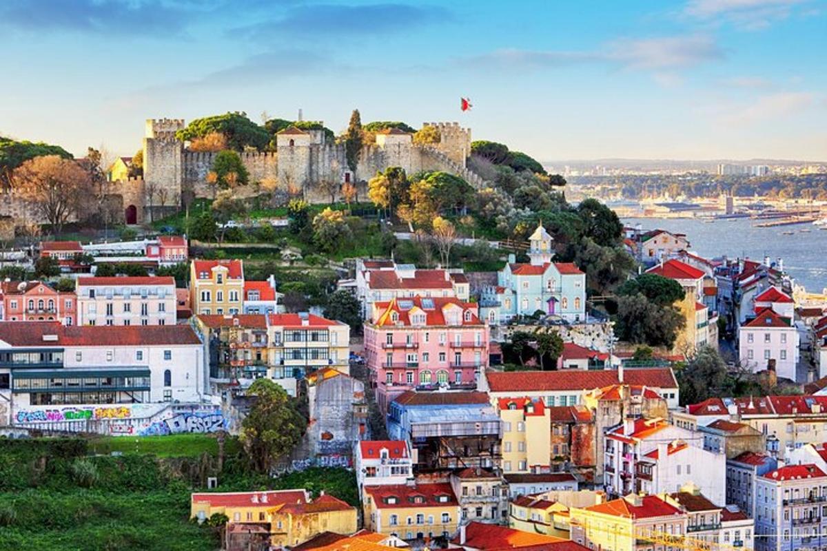 an aerial view of a city with a castle