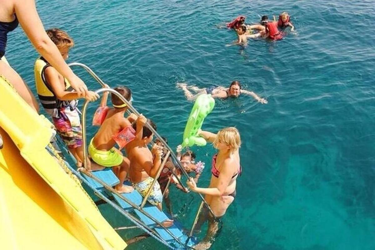 a group of people in the water on a boat