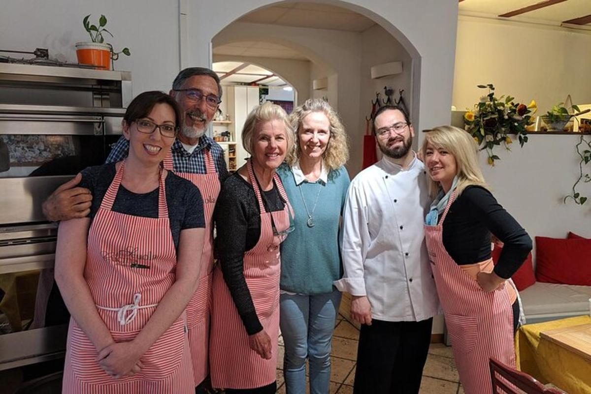 a group of people in aprons posing for a picture