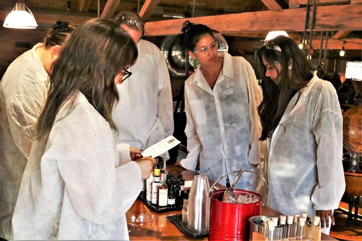 a group of people standing at a counter in a kitchen