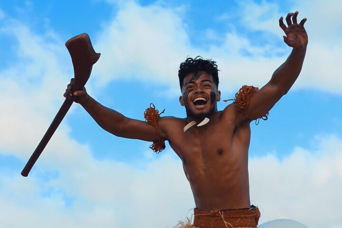 a shirtless man holding a paddle in the air