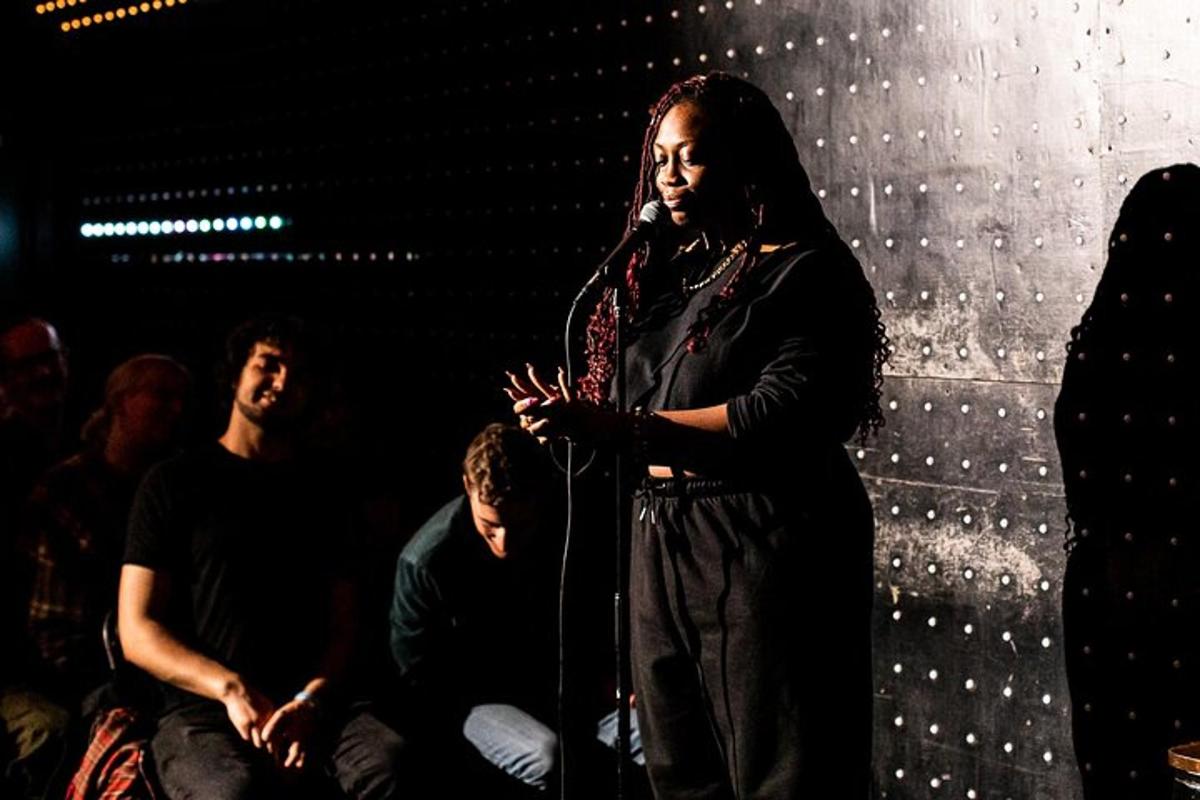 a woman standing in front of a microphone