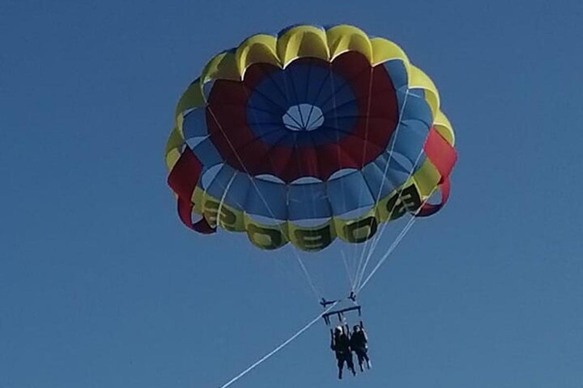 a group of people on a parachute in the sky