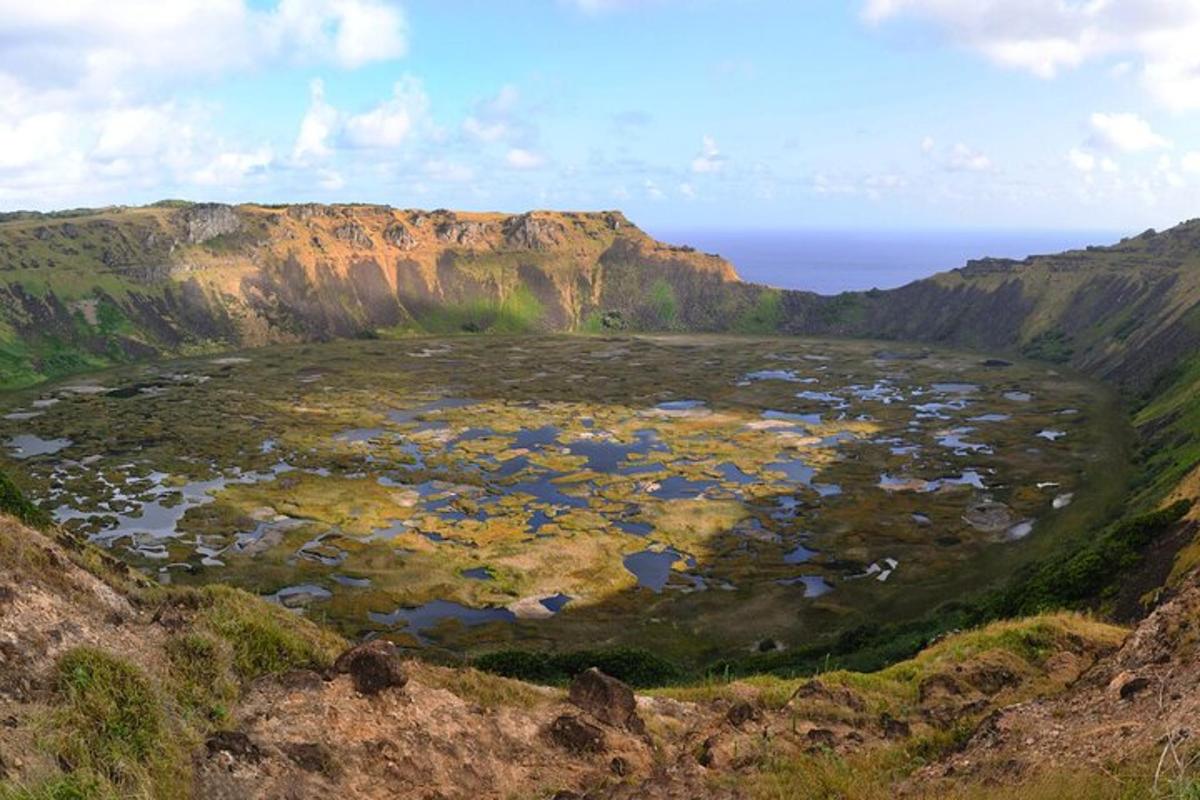 an aerial view of a large crater in a mountain