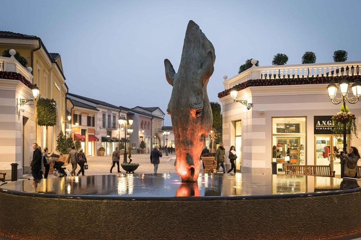 a statue of a dog in the middle of a street