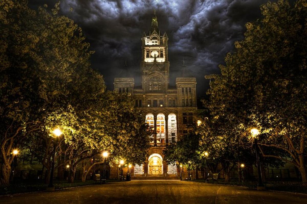 a large building with a clock tower at night