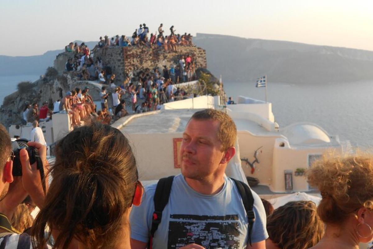 a group of people standing on top of a mountain
