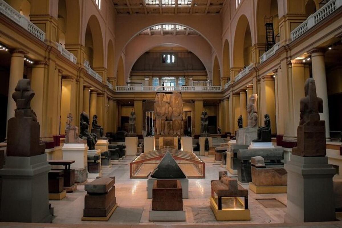 a museum with a large room with statues in it