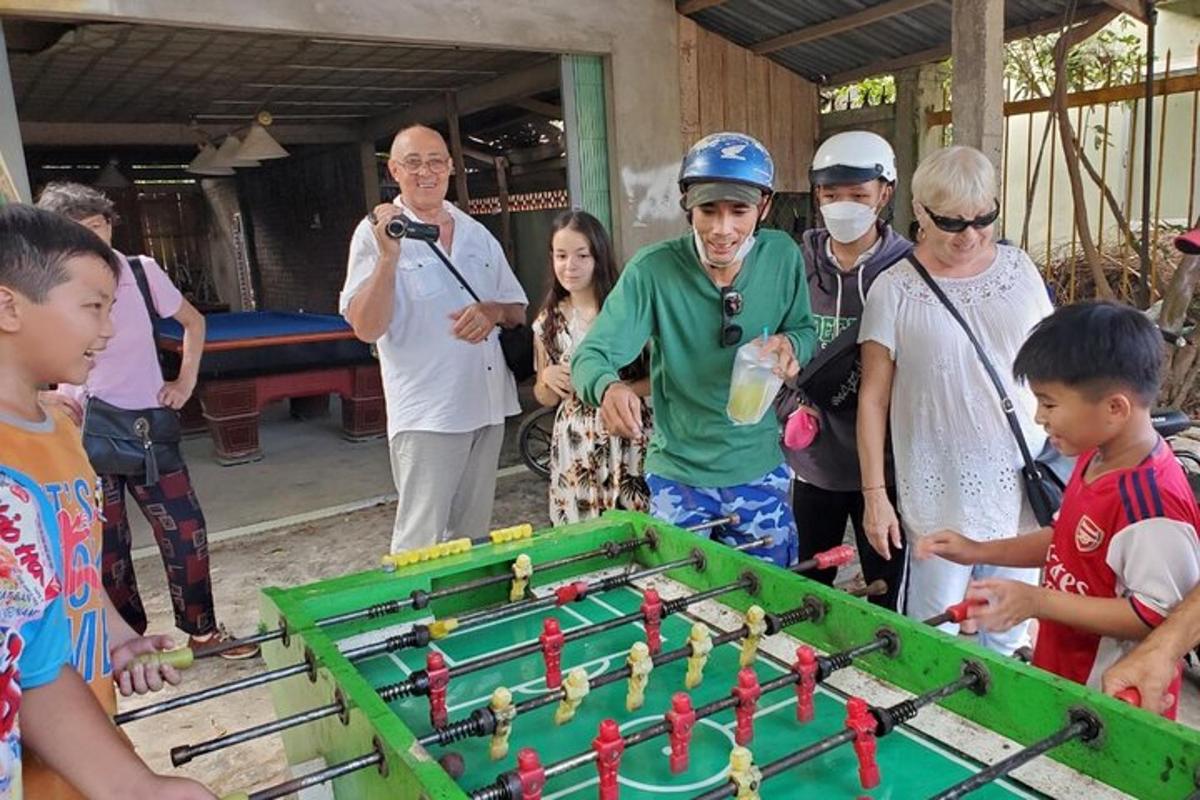 a group of people standing around a table with a game