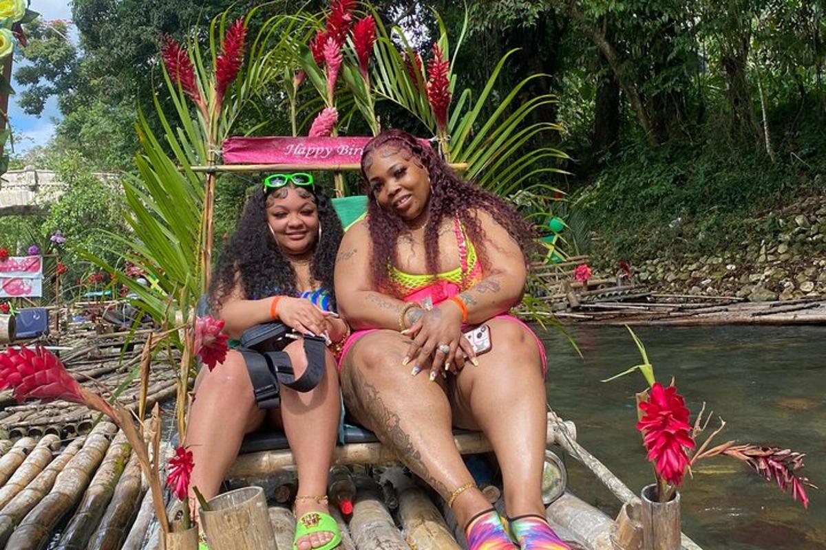 two women sitting on a raft in the water