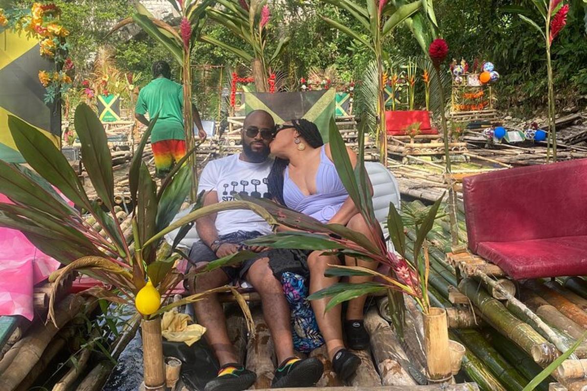 a man and woman sitting on a chair in a garden
