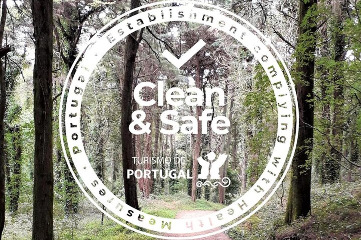 a sign that says clean and safe in a forest
