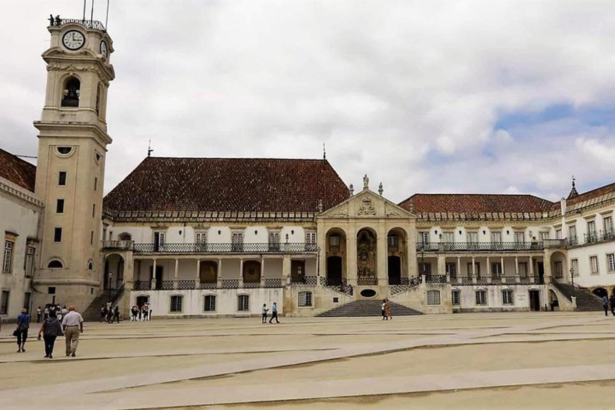 a large building with a clock tower in front of it
