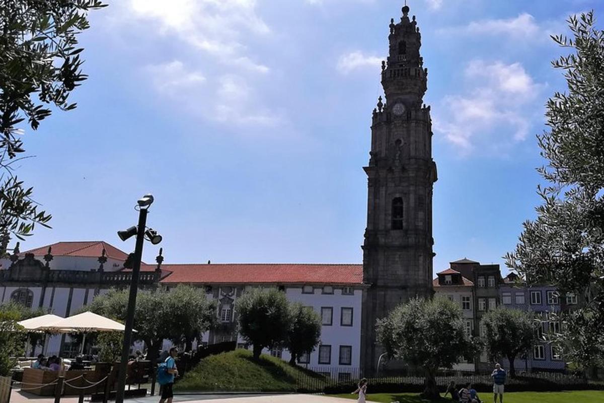 a large building with a clock tower in front of it