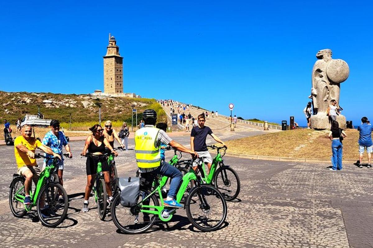 a group of people riding bikes in front of a lighthouse