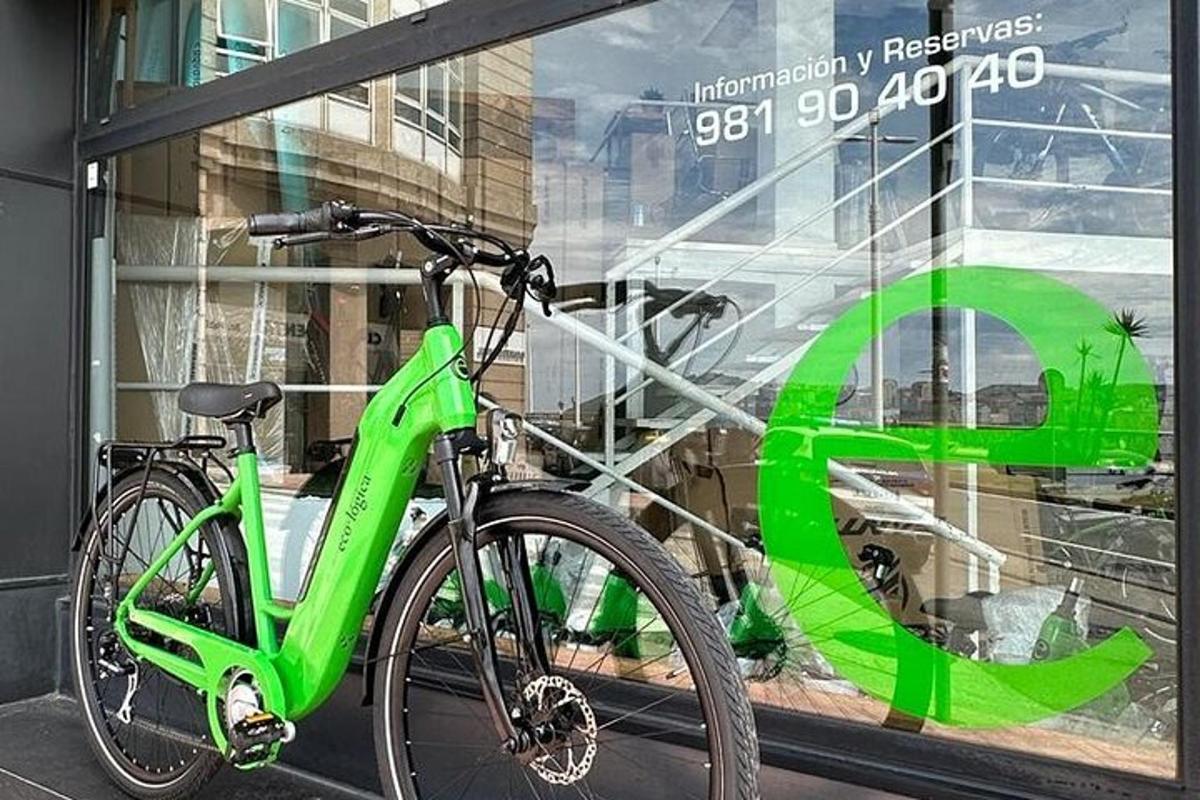 a green bike parked in front of a window