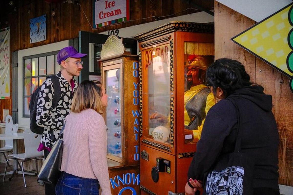 a group of people standing in front of a vending machine