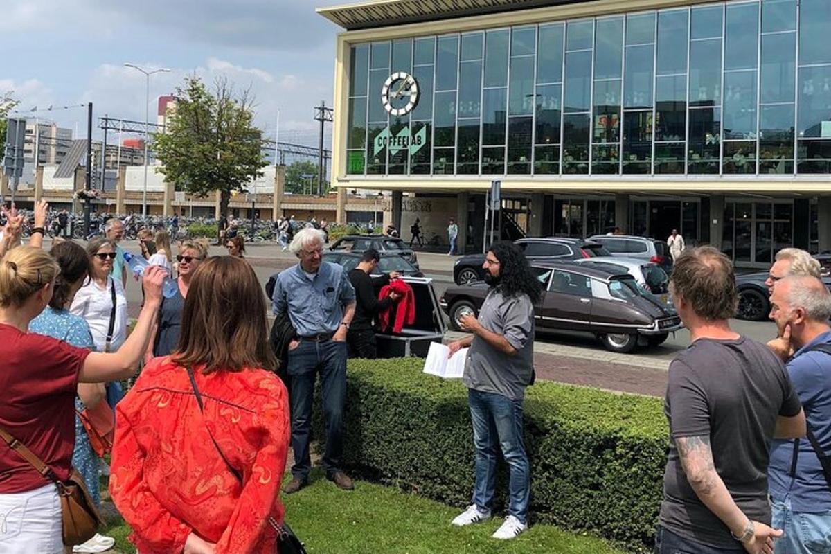 a crowd of people standing in front of a car dealership