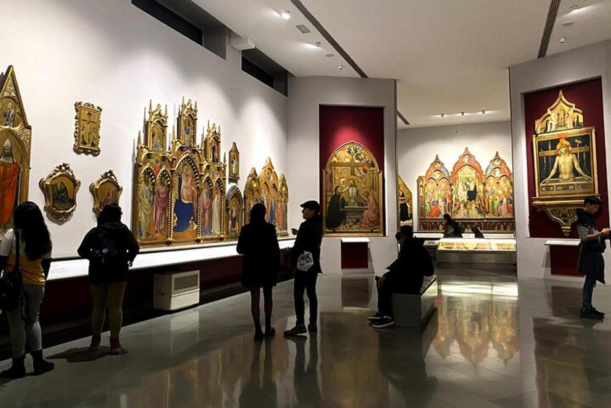 a group of people looking at art in a museum