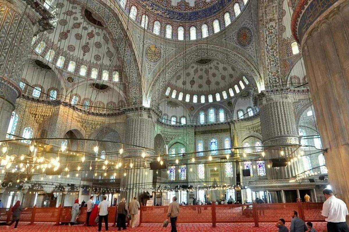 a large building with a domed ceiling with people in it