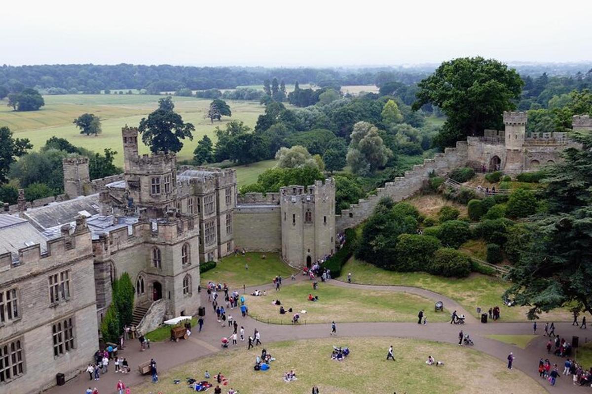 a group of people walking around a castle