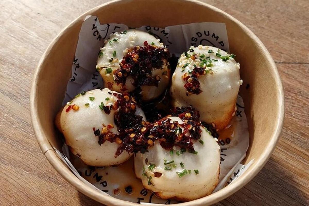 a bowl of donuts with toppings in it