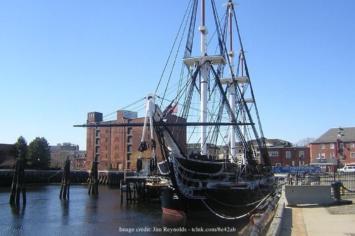 a boat sitting in the water next to aarf
