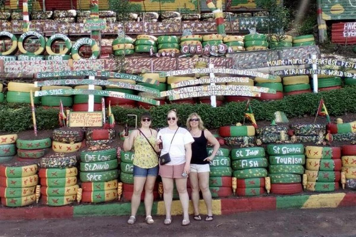 three women standing in front of a display of wine bottles